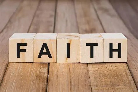 Wooden blocks spelling FAITH on rustic wooden surface