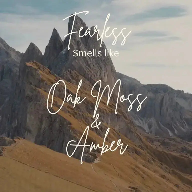 Fearless scented product promo with oak moss and amber text over mountain landscape